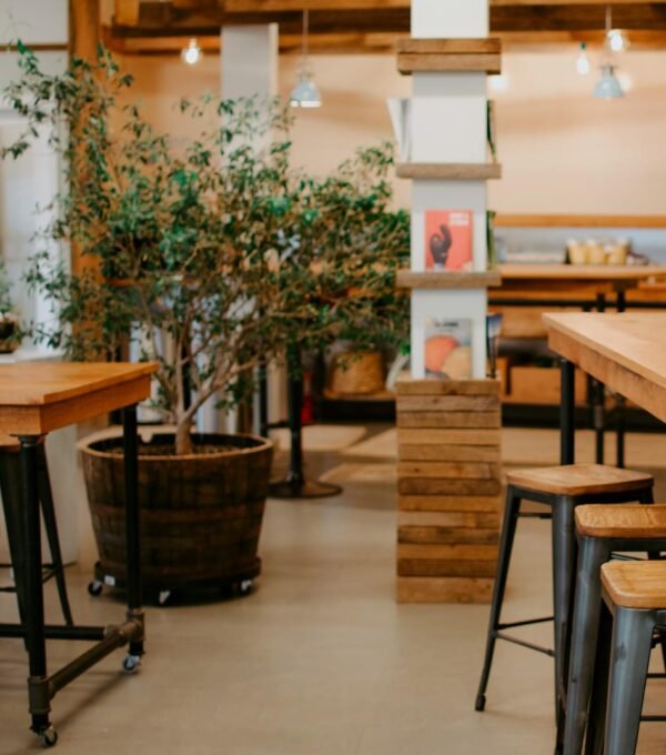 Warm and inviting café interior showcasing rustic wooden furniture and décor.
