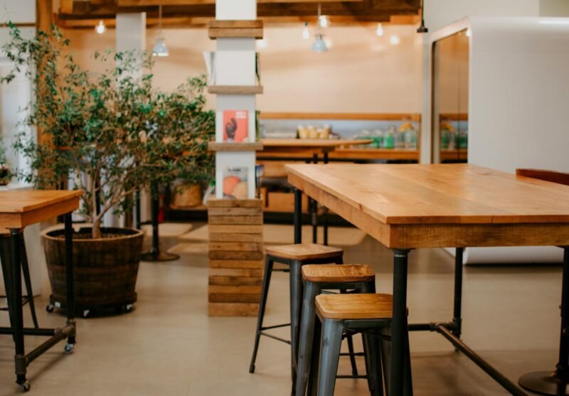 Warm and inviting café interior showcasing rustic wooden furniture and décor.